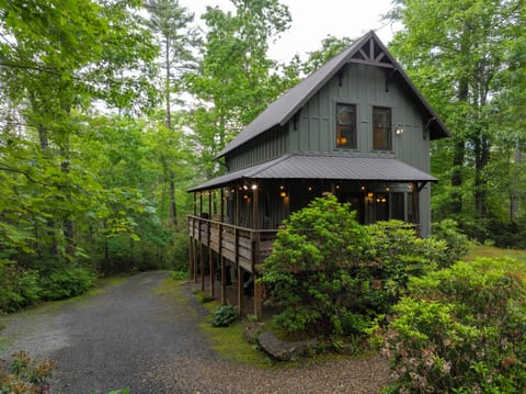 Summer Haven Cabin with parking area to side.