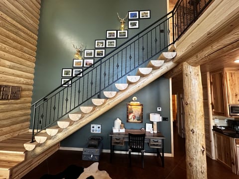 Stairway to loft displaying local wildlife photos