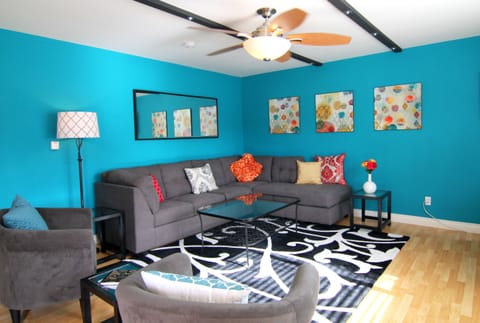 Living area, bright and spacious. Sofa has a sleeper bed.