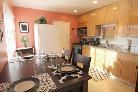 Kitchen, with brand new Samsung stove. Seating can accommodate six.
