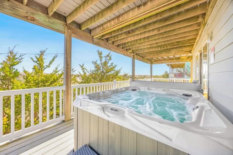Unwind in your private hot tub on the covered deck, where warm bubbles and peaceful tree views create the perfect retreat.