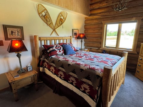 Guest bedroom with Pendleton blankets , original art work and real snowshoes.