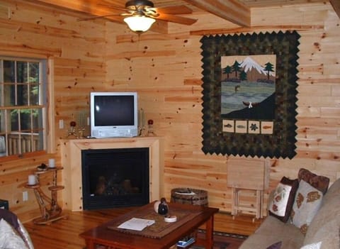 Living Room leading out to covered porch overlooking creek