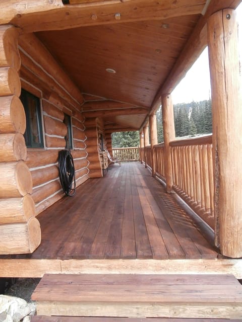 Wrap around porch on 3 sides. Chairs for lounging, reading or listening to creek