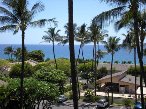 View of ocean and swimming pool/BBQ area