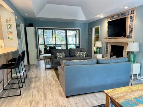 Bright and open Sparrow Pond Cottage with comfy living room and Roku TV.