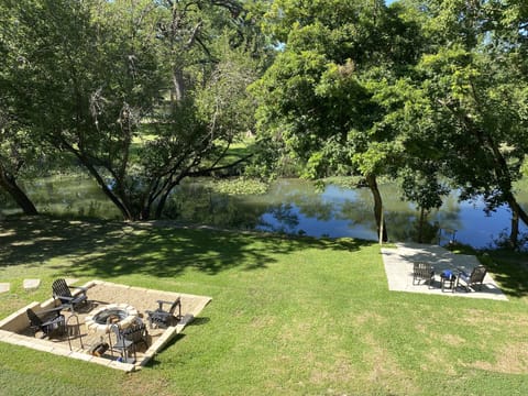Riverfront with seating areas and fire pit 