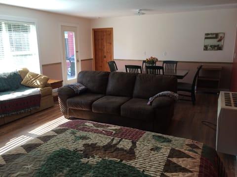 Dining table easily seats 6 without the leaf. Lots of extra chairs.