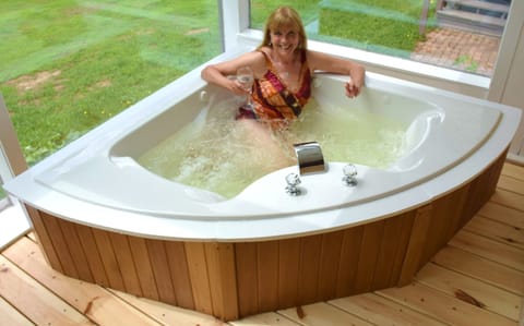Large two person Jacuzzi in sunroom. 
