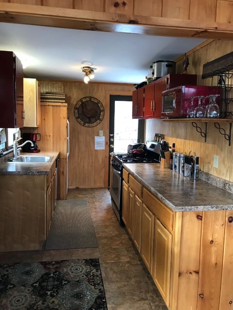 Open kitchen just off the dining room with ample storage, gas stove & dishwasher