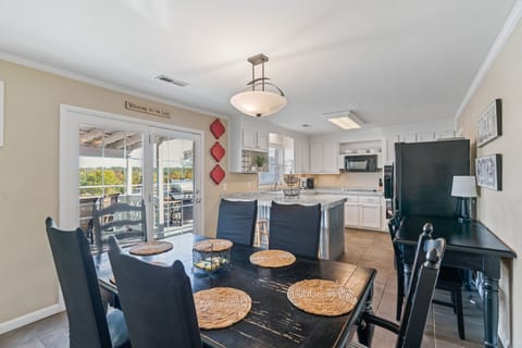 Large fully stocked kitchen with view of lake
