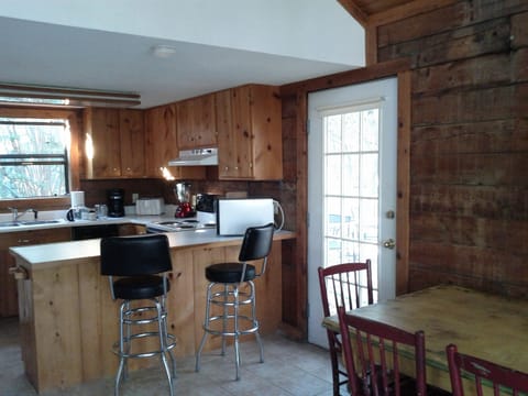 fully stocked kitchen, super clean, dining table seats 4 + bar area for 2