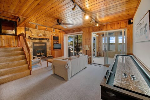 Lower level living area with gas fireplace and walkout to the outdoor patio