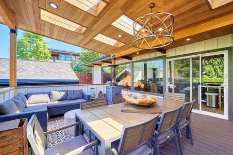Seating area of back deck with slider into kitchen