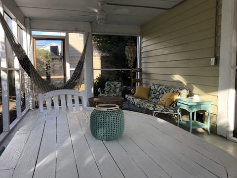 Screened room on lower level with two ceiling fans , perfect for outdoor dining 