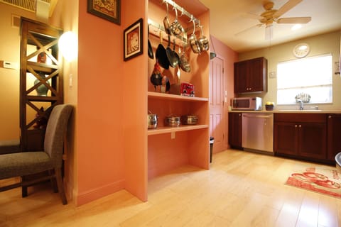 Open kitchen with updated espresso wood cabinets, plenty of quality cookware.