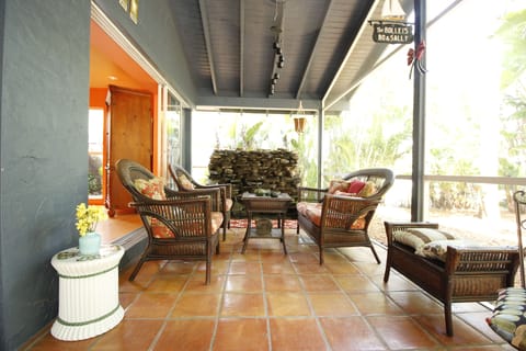 Private Front Porch surrounded by tropical native plants. Perfect for lounging!