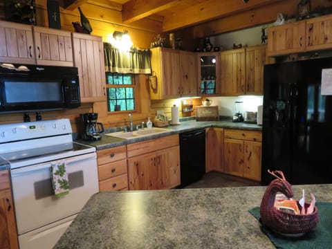 Fully equipped kitchen with full-sized appliances, coffee maker, blender & more