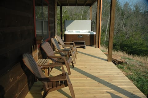 Hot tub has a view of mountain and Lake Chatuge. 