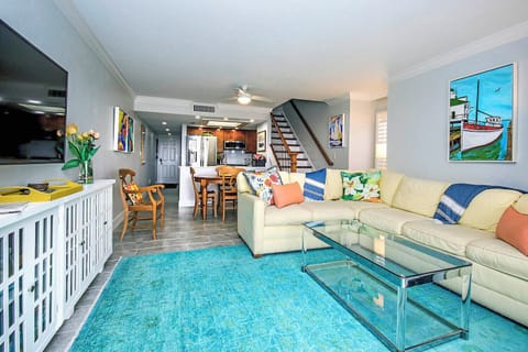 Living Room and dining table with built-in leave for seating 8 people.