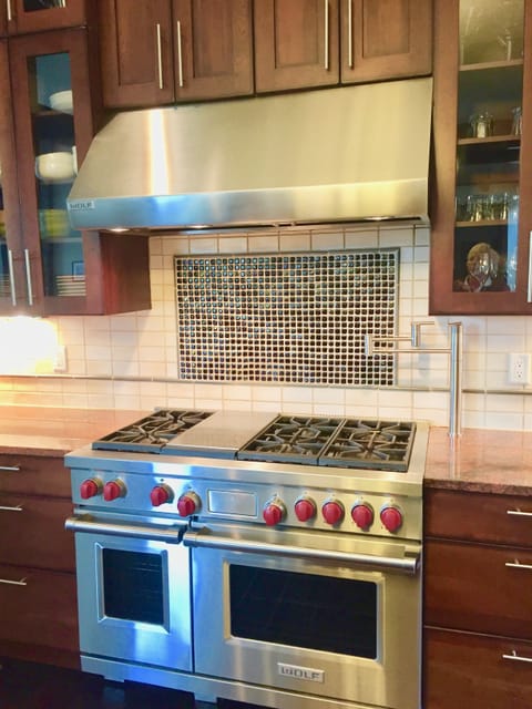 Six-Burner Gas Stove with Double Ovens and Pot Filler