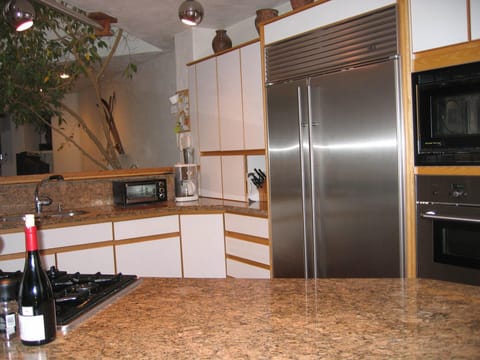 Gourmet kitchen with granite and sub-zero refrigerator/freezer