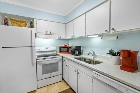 Kitchen equipped with drip coffee maker and Keurig.