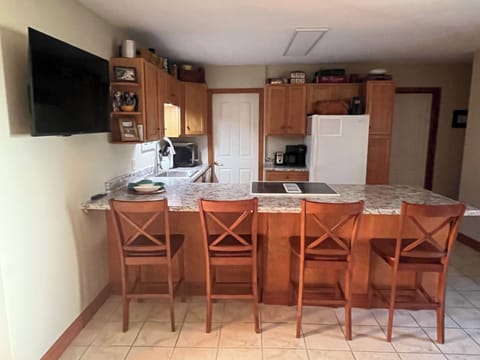 Updated in 2025 kitchen with new countertops, sink, bar stools, and paint