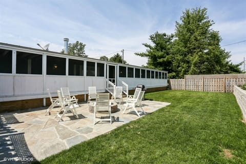 Front Yard off the 600 square foot screened patio and fire pit on stone patio