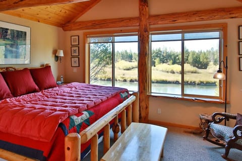 Primary bedroom with king and river views