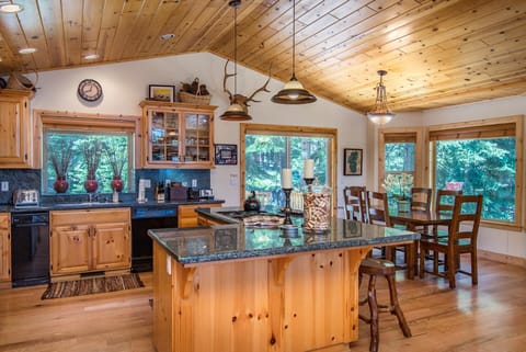 Kitchen and Dining Room; Back Deck features a gas BBQ