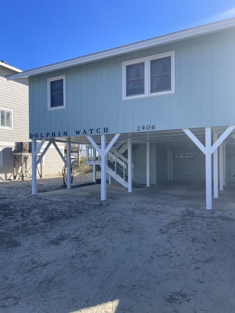 View of Dolphin Watch from the road with covered paring