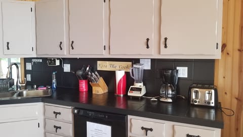 The kitchen counter well stocked with appliances.
