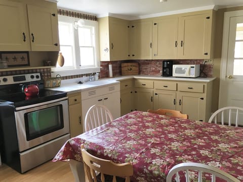 Modern kitchen with a true country feel and new flat top stove