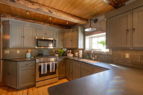 The kitchen.  New glass and china - light and roomy.
