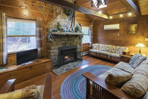 Dramatic Living Room with 2 Story Stone Fireplace and Knotty Pine Atrium Ceiling
