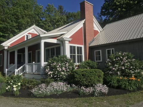Front of House with Flowers in Full Bloom