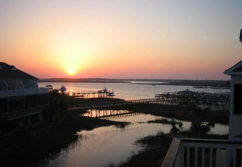 Watch Spectacular Sunsets from the master balcony or the dock at Waters Edge