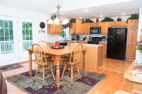 Dinning room. Gathering table seats 8  58x58 inches. Extra seating  if needed. 