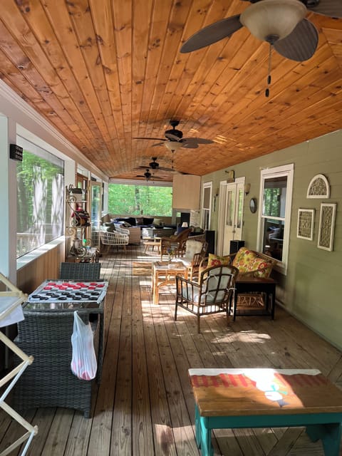 North side of porch with checkers table and seating areas.