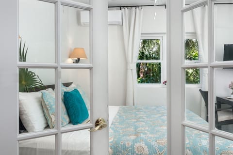 Enter the kitchenette through elegant French doors and discover a fully equipped culinary haven, boasting complete kitchen amenities that cater to your every cooking need