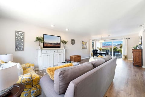 Bright, open living space with mountain views—comfortable, calm, and easy to settle into.