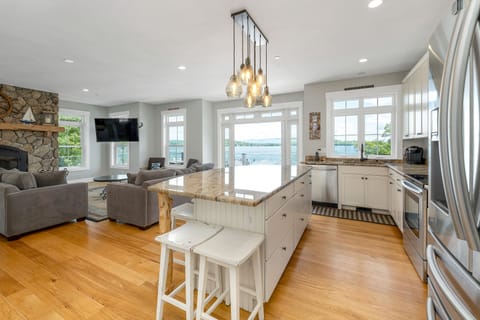 Beautiful open concept kitchen and living room with great lake & mountain views