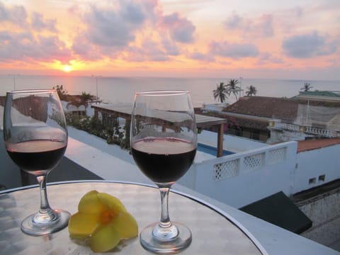 Enjoy private rooftop terrace with beautiful ocean views fanned by  Caribbean B.