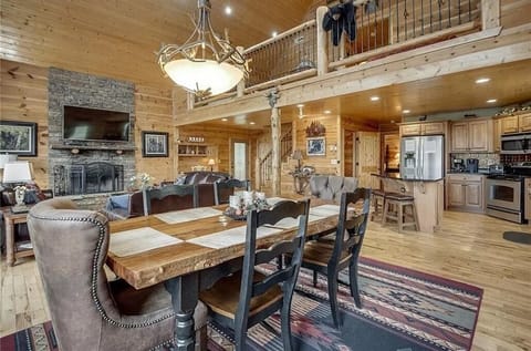 Dining room seats six,  kitchen island has three stools, folding table available