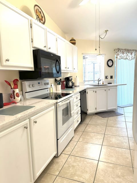 Kitchen includes, dishwasher, microwave, frig and pass thru window to lanai