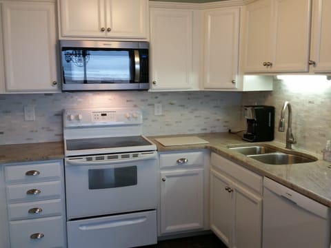 Upstairs main kitchen. Notice the reflection of the ocean on the microwave.
