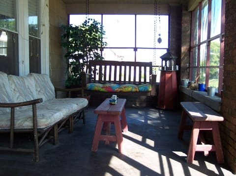 Relaxing  23' Brick Enclosed Screen Porch.