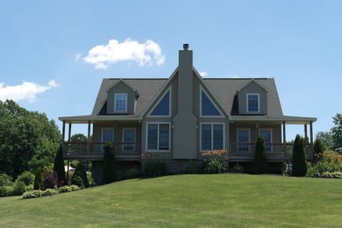 Front of House with westerly views for watching gorgeous sunsets!
