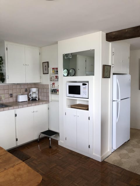 Mirror, microwave, and cabinets. Fridge just around the corner. Well stocked.